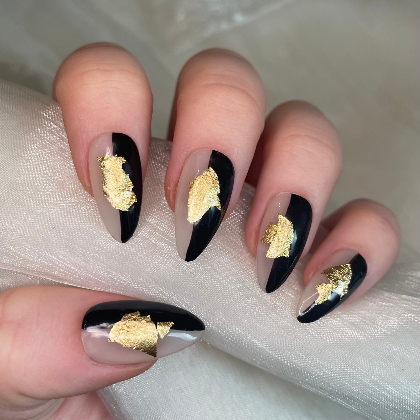 Sheer Nude, Black and Gold Leaf Design Almond Nails