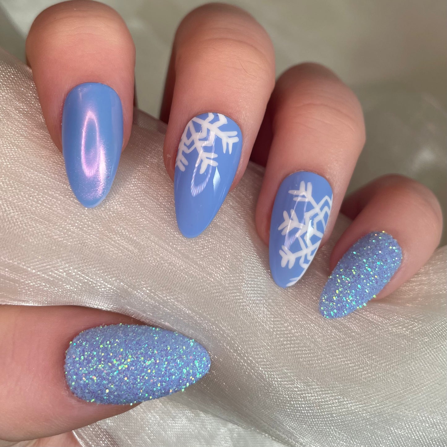 Baby Blue Snowflake Chrome and Glitter Almond Nails