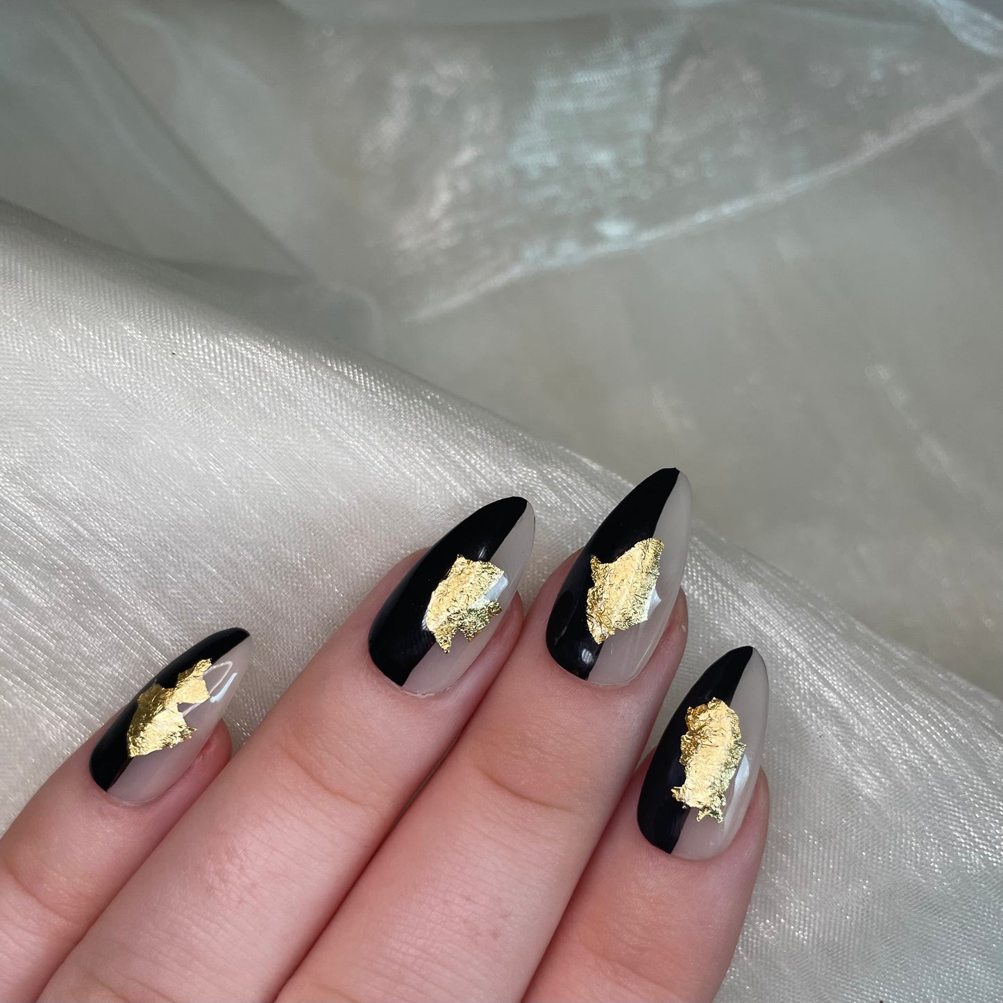 Sheer Nude, Black and Gold Leaf Design Almond Nails