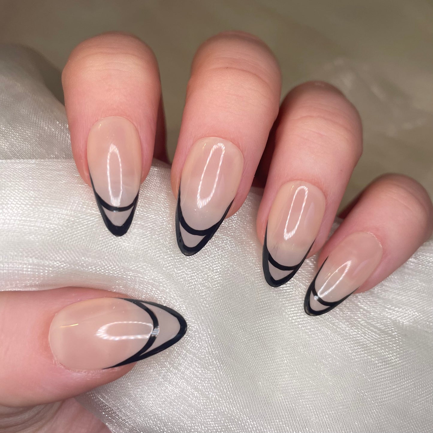 Sheer Nude Almond Nails With Black Fine Line Detail