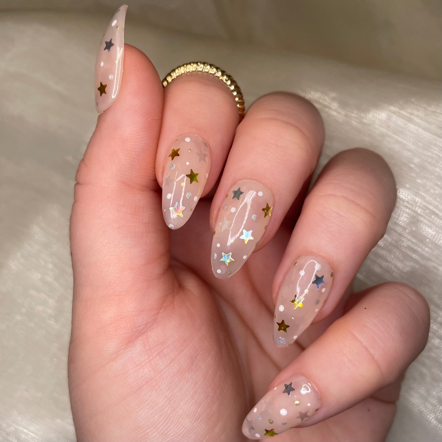 Sheer Nude Star Almond Nails