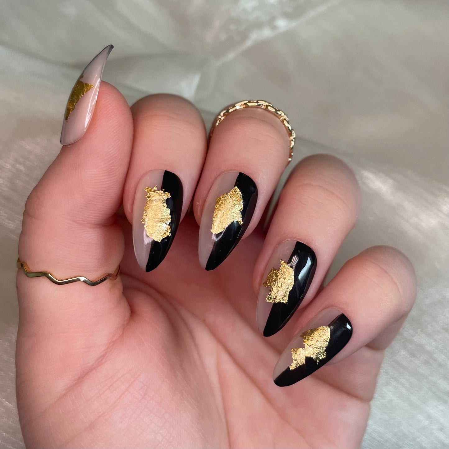 Sheer Nude, Black and Gold Leaf Design Almond Nails