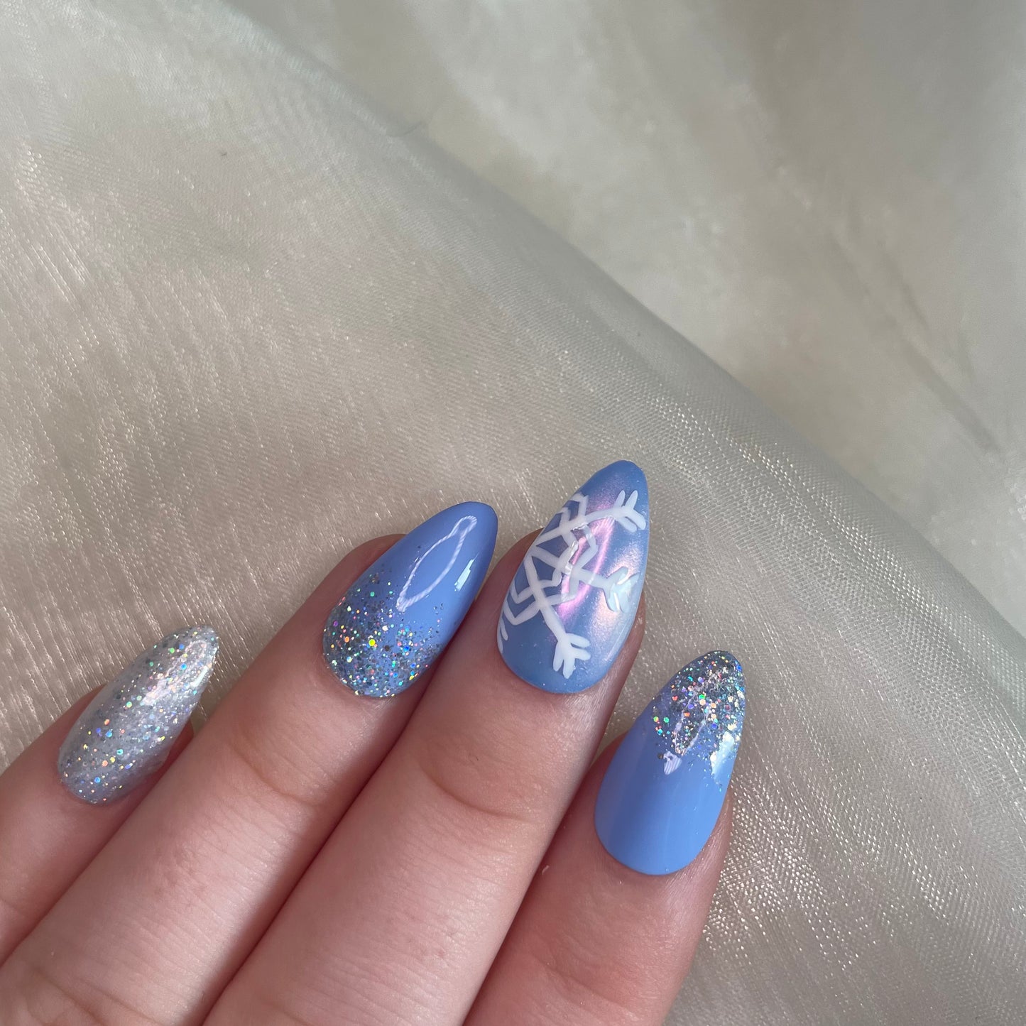 Baby Blue Snowflake Almond Nails with Glitter Ombré and Chrome Design