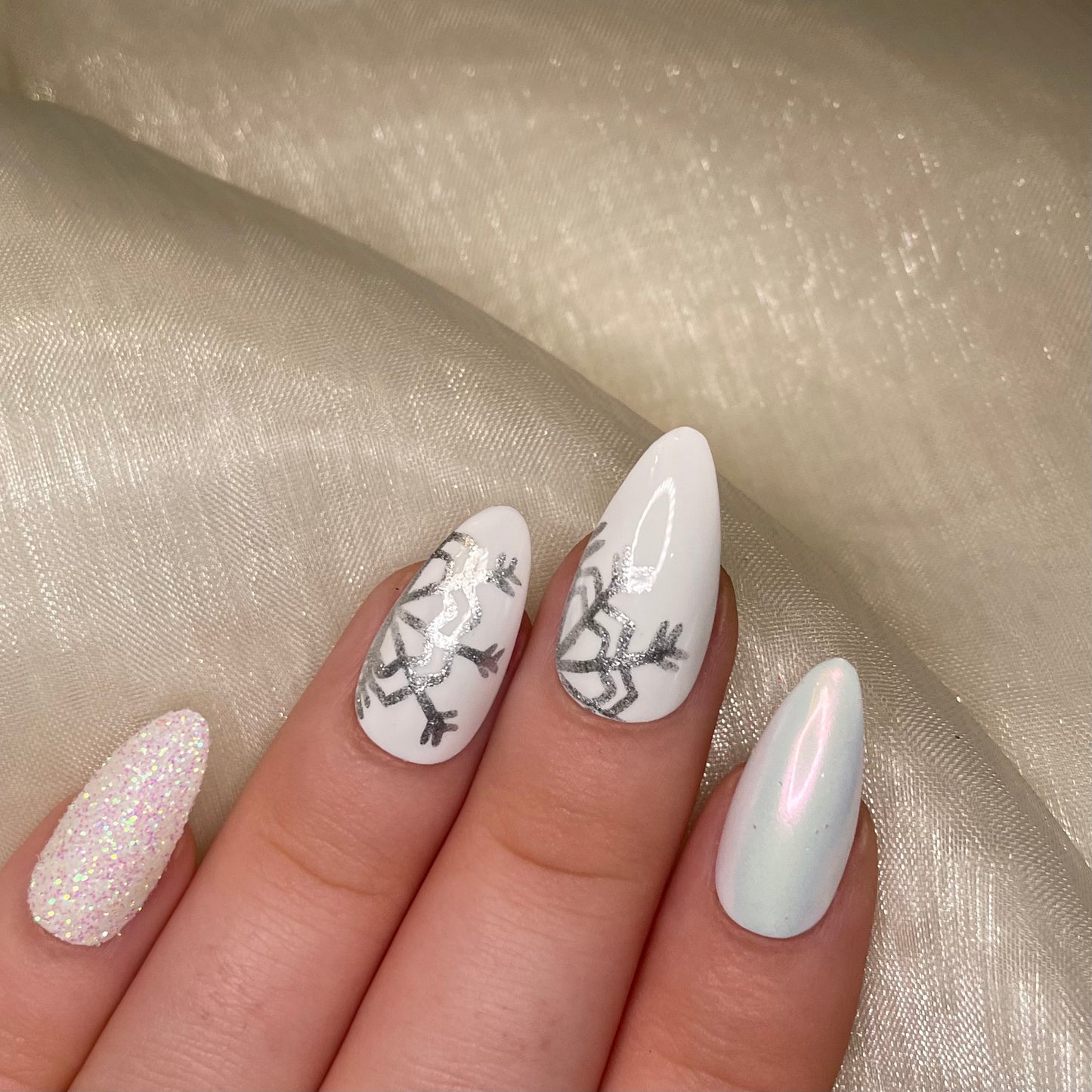 White Snowflake Glitter and Chrome Almond Nails